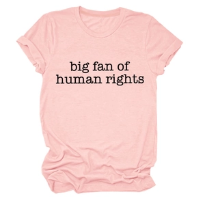 Detail of soft pink cotton t-shirt featuring big fan of human rights print text