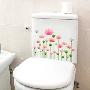 Pink lotus floral wall decals applied to white ceramic toilet tank for bathroom decor