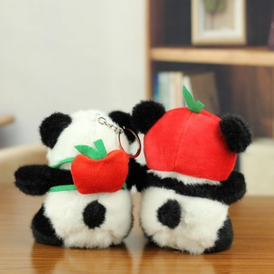 Cute panda plush keychains with red apple hat and backpack accessories shown from behind