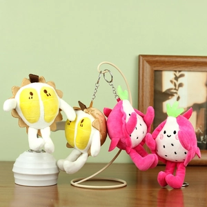 Porte-clés en peluche fruit du dragon et durian avec attaches en métal sur fond doux