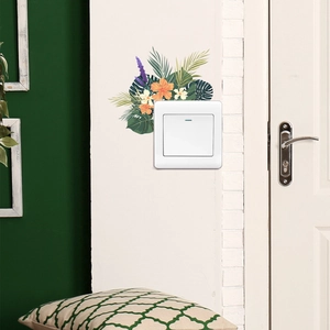 Detail of tropical plant light switch sticker featuring vibrant hibiscus and palm leaves