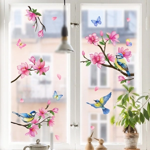Floral magnolia and bird window decals for home decor set against a white window frame