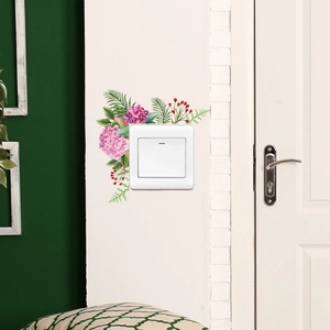 Detail of pink hydrangea and green leaves wall sticker applied around a light switch
