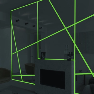 Glow-in-the-dark green luminous tape decorating modern home interior wall and mirror