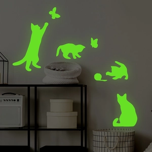 Stickers muraux lumineux avec silhouettes de chats et papillons verts fluorescents