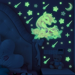 Luminous unicorn and moon wall stickers set with glowing green stars for kids room decor
