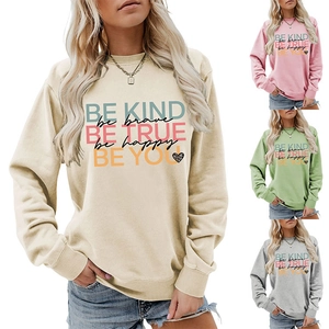Detail view of colorful motivational letter print on women's crewneck sweatshirts
