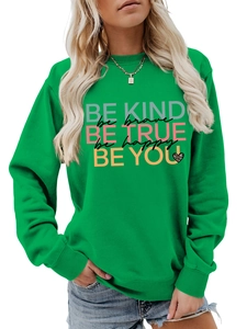 Detail of green long sleeve sweatshirt featuring colorful inspirational letter print design
