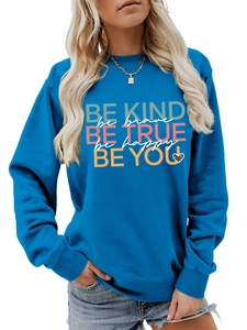 Detail of blue crewneck sweatshirt with colorful inspirational slogans and leopard heart