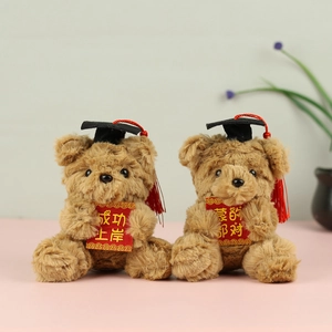 Brown graduation bears with black caps and red tassels holding motivational greeting cards
