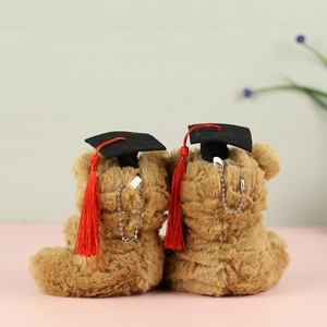 Detailed back view of plush graduation bears with doctor caps and silver bead chains