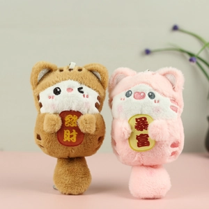 Detail of plush cat keychains with Fortune and Wealth embroidered charms