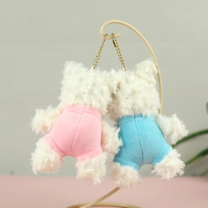 Rear view of pink and blue plush puppy charms with white faux fur and golden bead chains