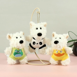 Detailed view of three Westie plush charms wearing frog, panda and duck costumes