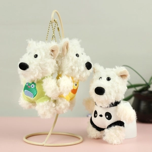 Detailed view of three Westie plush charms with colorful frog, chick, and panda vests