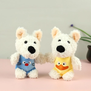 Cute Westie dog plush keychain charms in blue cat and yellow duck pajamas on pink background