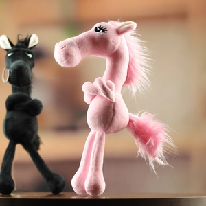 Detail of pink plush horse mascot with long eyelashes and soft faux fur texture