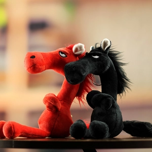 Detailed close-up of plush horse pendants in red and black with funny grumpy expressions