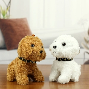 Close-up of white and brown plush dog charms with curly fur and golden star collars
