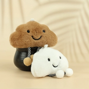 Detailed view of cute plush white and brown cloud charms with striped legs and soft fur