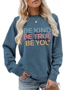 Detail of grey-blue crewneck sweatshirt featuring inspirational slogans and leopard heart