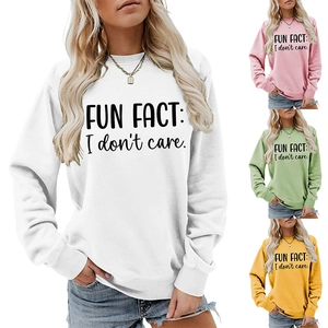 Detail of colorful long sleeve crewneck sweatshirts with Fun Fact I Don't Care slogan
