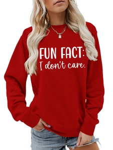 Close-up of FUN FACT: I don't care slogan print on red crewneck sweatshirt