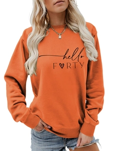 Detail of hello FORTY text and heart print on orange long sleeve cotton sweatshirt