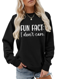 Detail of black crewneck sweatshirt with 'FUN FACT: I don't care' white text print