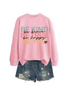 Detail of pink sweatshirt with rainbow inspirational text and denim shorts set