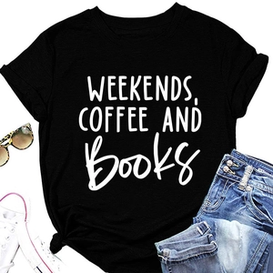 Detail of minimalist black t-shirt with Weekends Coffee and Books print on a flat lay