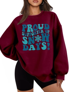 Close-up of wine red oversized sweatshirt featuring Proud Supporter of Snow Days print