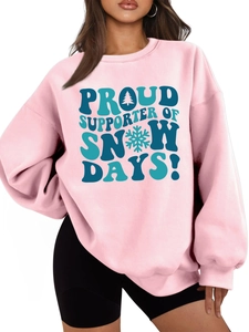 Detail of pink fleece sweatshirt with proud supporter of snow days graphic print