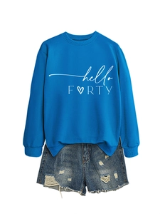 Detail of hello FORTY printed blue sweatshirt paired with distressed denim shorts