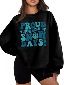 Detail of black sweatshirt featuring the Proud Supporter of Snow Days graphic text
