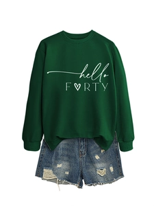 Close-up of hello FORTY sweatshirt in dark green paired with distressed denim shorts