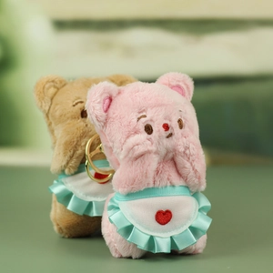 Cute plush bear keychain with mint green apron and heart embroidery in pink and brown