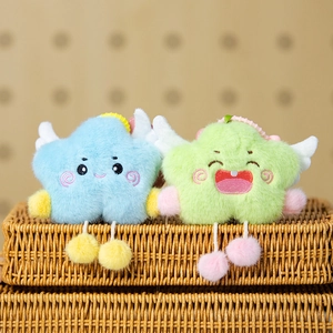 Close-up of cute plush cloud keychains with tiny wings and colorful fuzzy ball legs