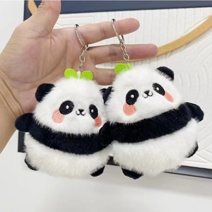 Cute plush panda keychain pair with green leaf detail and silver metal clasp