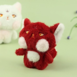 Close-up of a plush red fox keychain toy featuring soft faux fur and embroidery details