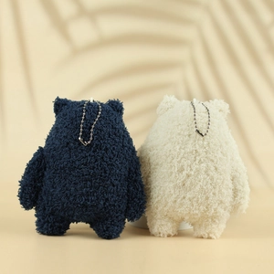 Rear view of cute plush bear pendants in navy blue and cream white with silver chains