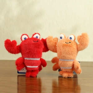 Cute plush lobster and crab bag charms made of soft red and orange long-pile fabric