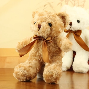 Detailed texture of plush teddy bear with a soft silk ribbon bow on a wooden base