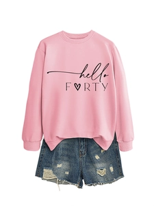 Flat lay of pink sweatshirt with hello FORTY text and distressed blue denim shorts