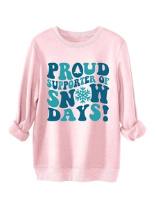 Detail of pink sweatshirt featuring Proud Supporter of Snow Days print with pine trees