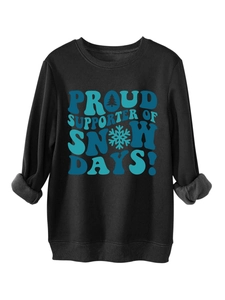 Detail of black sweatshirt showing thick grey fleece lining and snow day graphic print