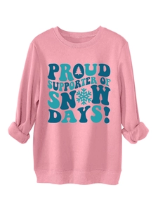 Detailed view of pink hoodie with Snow Days print, ribbed cuffs and winter themed art