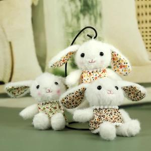 Detailed plush bunny keychain set with floral patterns and soft white fur textures