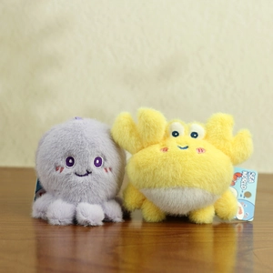 Detailed view of soft plush sea world animal toys with cute embroidery and blue tags