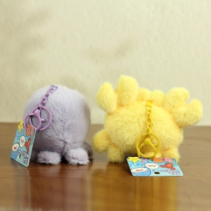 Detail of plush ocean animal keychains with soft texture and SEA WORLD tags